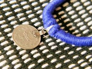 collane in cotone intrecciato con pendaglio  moneta antica afgana con scrittura araba .  pezzi unici con pendaglio riciclato .  ulteriori info e foto contattare .