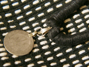 collane in cotone intrecciato con pendaglio  moneta antica afgana con scrittura araba .  pezzi unici con pendaglio riciclato .  ulteriori info e foto contattare .