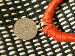 collane in cotone intrecciato con pendaglio  moneta antica afgana con scrittura araba .  pezzi unici con pendaglio riciclato .  ulteriori info e foto contattare .