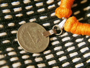 collane in cotone intrecciato con pendaglio  moneta antica afgana con scrittura araba .  pezzi unici con pendaglio riciclato .  ulteriori info e foto contattare .
