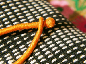 collane in cotone intrecciato con pendaglio  moneta antica afgana con scrittura araba .  pezzi unici con pendaglio riciclato .  ulteriori info e foto contattare .