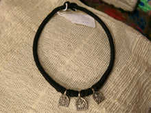 Carica l&#39;immagine nel visualizzatore di Gallery, collana in cotone intrecciato con tris di vecchi  pendagli in argento databili primi 900 raffigurante tipiche figure tribali dell&#39;india del nord .  misure collana 42 pendaglio 2 x 2 cm peso 21 gr 