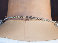 Carica l&#39;immagine nel visualizzatore di Gallery, collana nepalese / tibetana con bull in resina montate su argento lavorato, inciso a mano. assemblata artigianalmente, pezzo unico . collana con chiusura ad &quot;S&quot; , intervallata con elementi in argento .  lunghezza totale collana 56 cm misura sfera centrale 3.5 x 2 cm peso 150 gr