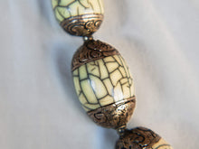 Carica l&#39;immagine nel visualizzatore di Gallery, collana nepalese / tibetana con bull in resina montate su argento lavorato, inciso a mano. assemblata artigianalmente, pezzo unico . collana con chiusura ad &quot;S&quot; , intervallata con elementi in argento .  lunghezza totale collana 56 cm misura sfera centrale 3.5 x 2 cm peso 150 gr