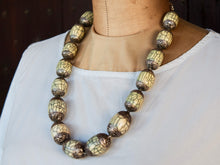 Carica l&#39;immagine nel visualizzatore di Gallery, collana nepalese / tibetana con bull in resina montate su argento lavorato, inciso a mano. assemblata artigianalmente, pezzo unico . collana con chiusura ad &quot;S&quot; , intervallata con elementi in argento .  lunghezza totale collana 56 cm misura sfera centrale 3.5 x 2 cm peso 150 gr
