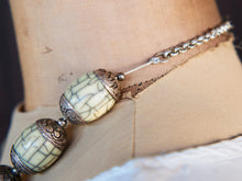 Carica l&#39;immagine nel visualizzatore di Gallery, collana nepalese / tibetana con bull in resina montate su argento lavorato, inciso a mano. assemblata artigianalmente, pezzo unico . collana con chiusura ad &quot;S&quot; , intervallata con elementi in argento .  lunghezza totale collana 56 cm misura sfera centrale 3.5 x 2 cm peso 150 gr