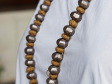 Carica l&#39;immagine nel visualizzatore di Gallery, collana indiana in cotone intrecciato ed elementi &quot;olive&quot; in cera con lamina di argento .   lunghezza totale 120 cm, misura regolabile misura singolo elemento in argento 1.5 x 1 cm,  peso 120 gr    per ulteriori info o foto watshapp 3338778241 mail info@etniko.it fb, ig, etsy &quot;etnikobycrosato&quot;