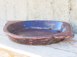 piatto in legno con 2 manici ricavato da un unico tronco di legno.  dimensioni 53x41 h7cm.